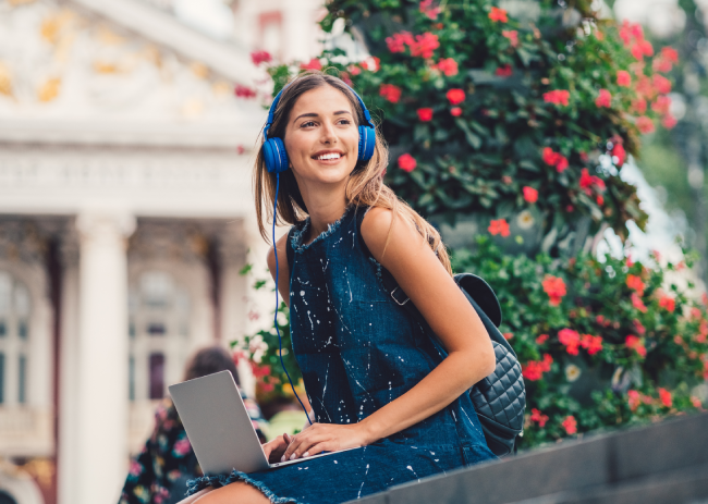 A beautiful woman listening to a podcast